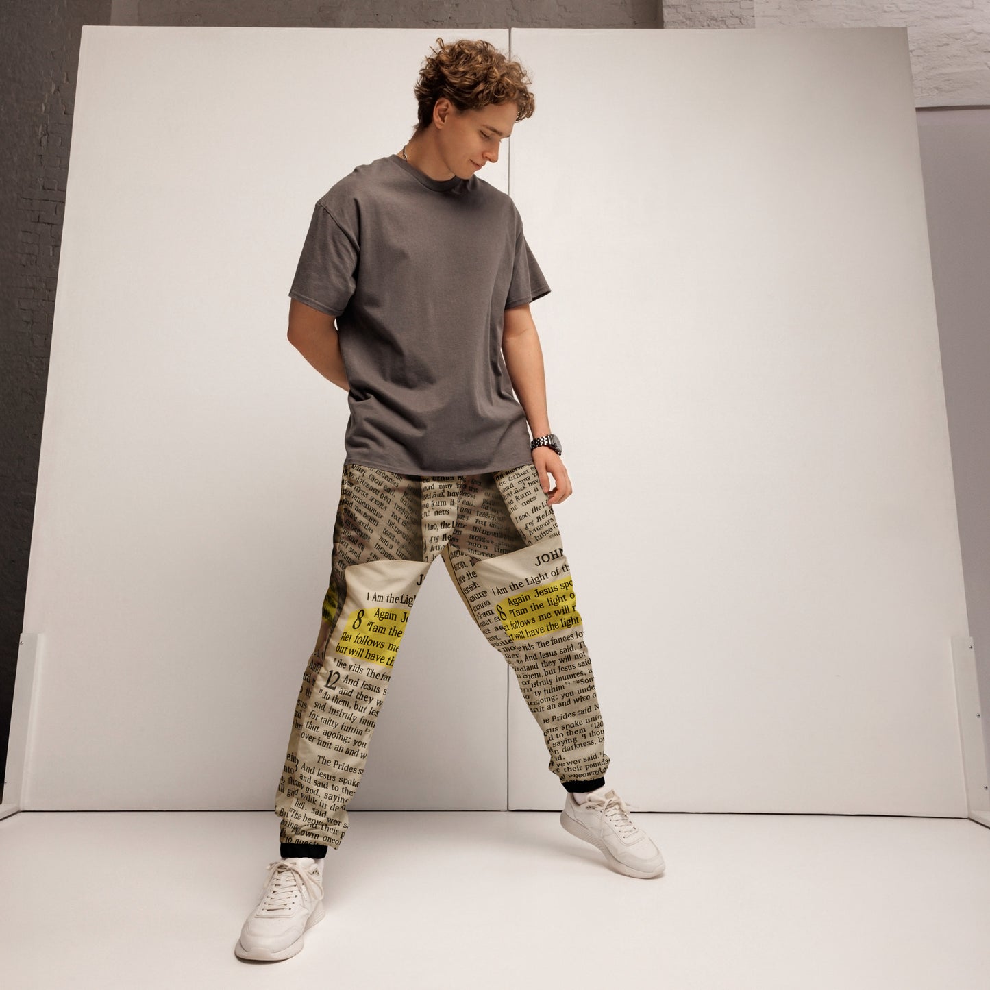 Golden Scripture – Unisex Track Pants The Golden Scripture track pants extend the sacred design with intricate detailing. Comfortable yet refined, they are designed to be worn as a striking set or a standalone statement. John 8:12 - Unisex Track Pants