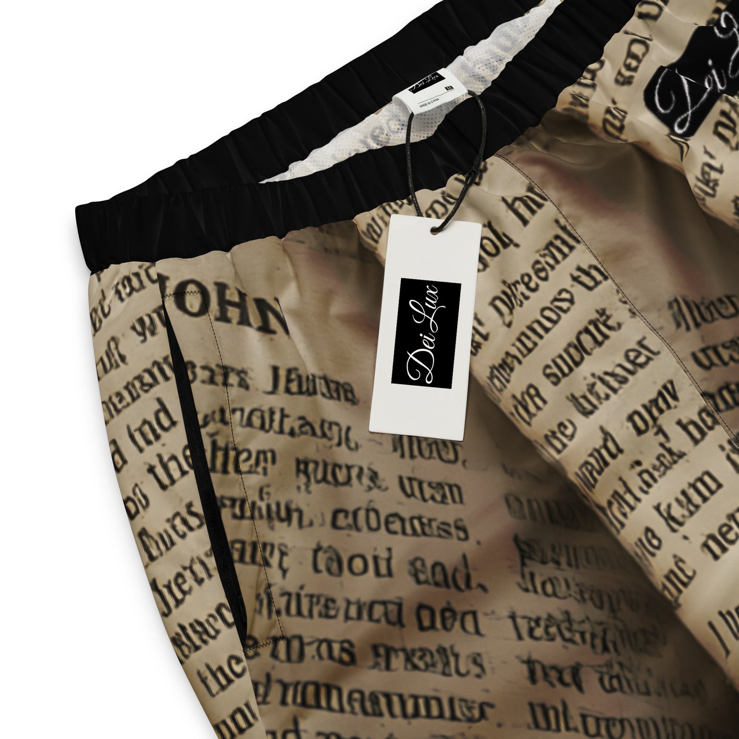 Golden Scripture – Unisex Track Pants The Golden Scripture track pants extend the sacred design with intricate detailing. Comfortable yet refined, they are designed to be worn as a striking set or a standalone statement. John 8:12 - Unisex Track Pants